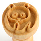 Panda-themed ceramic stamp made of light wood, featuring intricate carved details for decorating pottery and clay projects.
