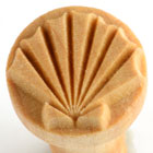 Ceramic texture stamp with a shell design, ideal for decorating clay pottery and creating unique surface patterns.