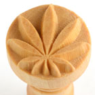 Wooden texture stamp with a leaf design, ideal for adding intricate details to clay pottery and surface decoration.