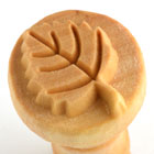 Leaf-shaped texture stamp for ceramics, ideal for adding decorative details to pottery and clay projects.