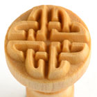 Wooden stamp with intricate, layered designs for decorating clay and pottery at Georgies Ceramic & Clay Company.
