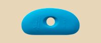 Thin blue ceramic rib tool with a hole, used for shaping and smoothing clay in pottery and sculpture projects.