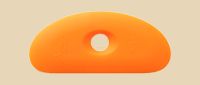 Orange silicone rib tool designed for shaping and smoothing clay surfaces in pottery and ceramics.