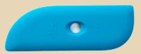 Blue rubber rib for shaping clay, ideal for smoothing surfaces in pottery and ceramics. Useful in hand-building techniques.