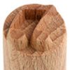 Close-up of a wooden clay rib tool featuring a textured edge, used for shaping and smoothing pottery and ceramic pieces.