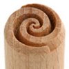 Close-up of a wooden pottery stamp tool with a spiral design, used for decorating clay and ceramics at Georgies Ceramic & Clay Company.