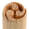 Detail of a wooden clay tool, featuring a spiral design at the tip, used for carving or decorating pottery and sculpture.