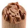 Wooden ceramic stamp with intricately carved design, used for decorating clay pottery and enhancing surface textures.