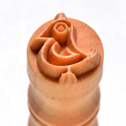 Wooden pottery stamp featuring a carved bird design, ideal for detailing clay surfaces in ceramics and pottery projects.