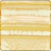 Layered glaze sample featuring warm yellows and creamy tones, ideal for pottery and ceramic sculpture applications.
