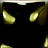 Black ceramic glaze with glossy finish, reflecting light; ideal for pottery and sculptural applications.