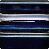 Deep blue and bright white glaze stripes on a ceramic test tile, showcasing glazing techniques for pottery.