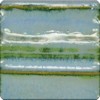 Glossy green and blue glaze sample featuring layered texture, ideal for ceramic pieces and artistic pottery applications.
