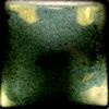 Ceramic glaze swatch featuring a green and gold mottled finish, showcasing texture and potential for pottery decoration.