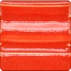 Glossy red ceramic glaze sample tile with a textured, striped surface for pottery and decorative applications.
