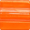 Glossy orange clay glaze sample, ideal for pottery decorating and kiln firing, showcasing vibrant color for ceramic projects.