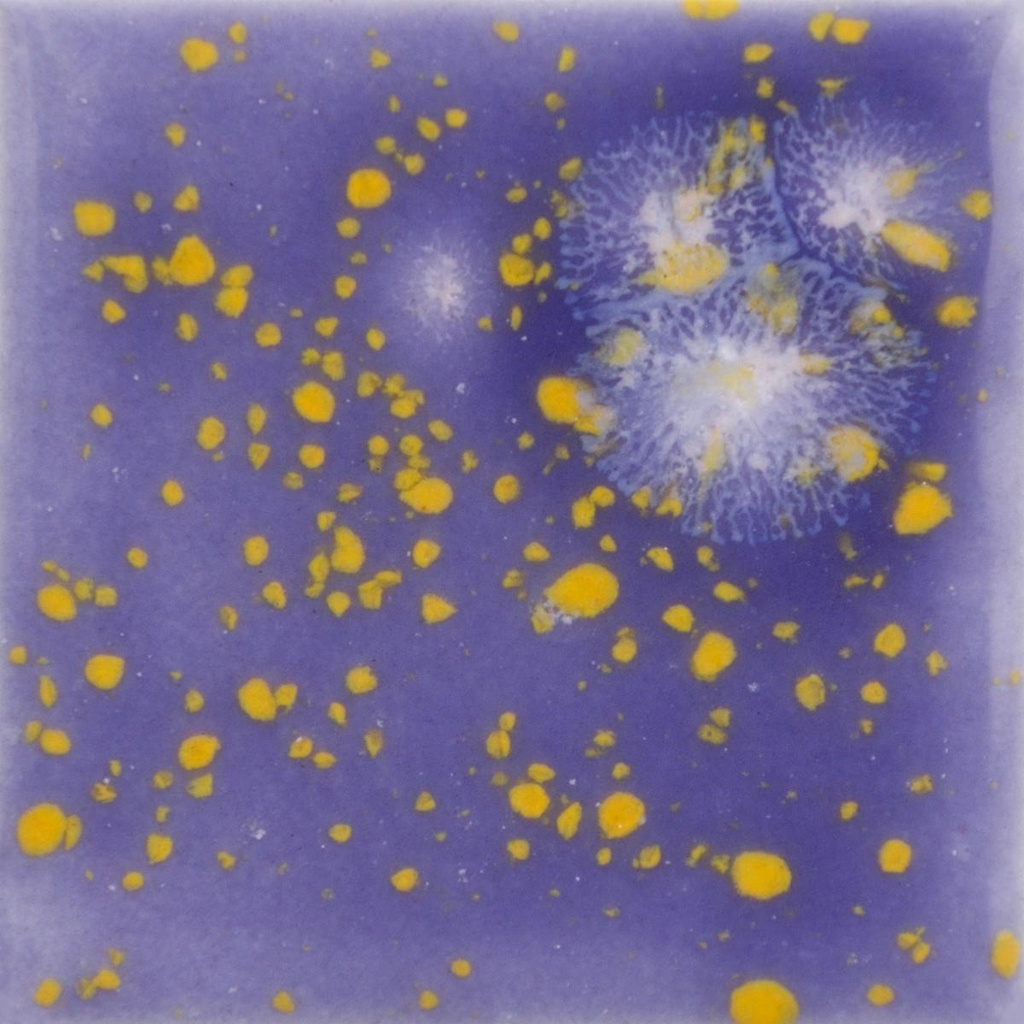 Decorative ceramic tile featuring a purple glaze with vibrant yellow and white speckles, showcasing unique color effects.