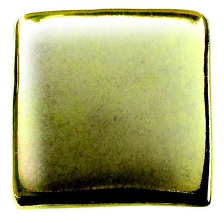 Glossy yellow-green ceramic glaze sample on a square tile, showcasing a smooth finish ideal for pottery decoration.