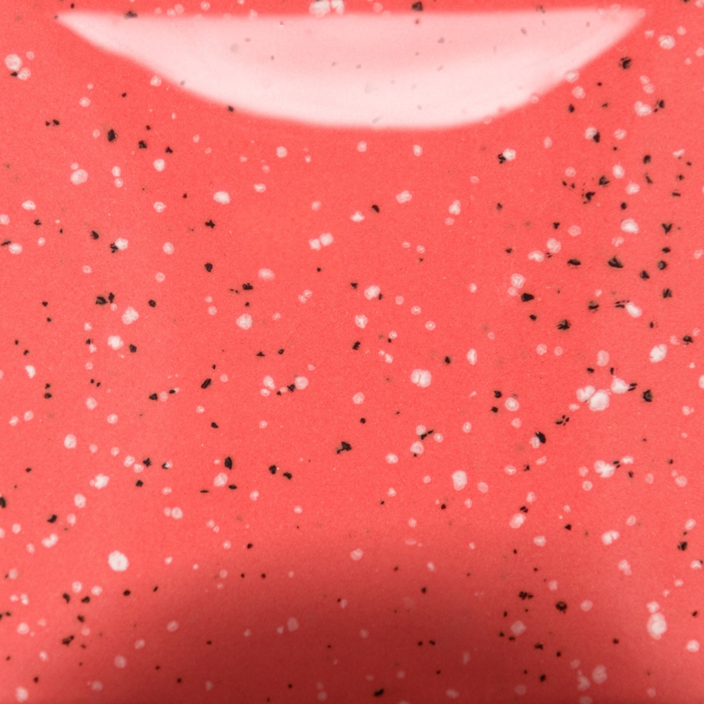 Bright coral glaze with white and black speckles, ideal for ceramic pottery projects or decorative finishes.