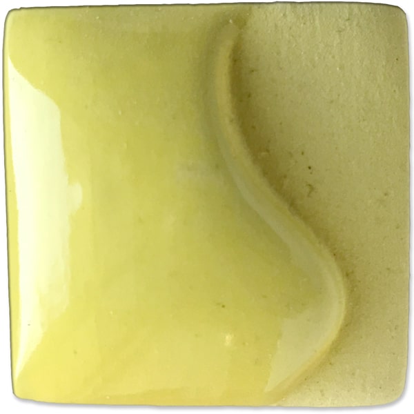 Glossy light yellow ceramic glaze sample with a smooth surface and slight curve, ideal for pottery and decorative projects.