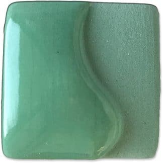 Ceramic glaze sample in a soft mint green with a subtle wave texture, ideal for pottery and decorative ceramics.