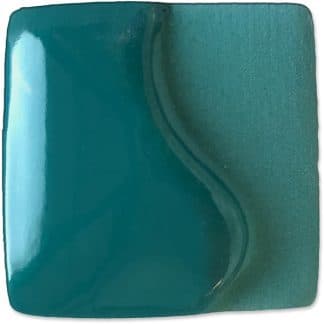 Teal ceramic glaze sample with a glossy finish, showcasing a smooth color transition ideal for pottery decoration.