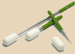 Set of ceramic modeling tools displayed on a beige background, including a tapered tool and two silicone-tipped styluses.