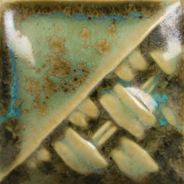 Detailed close-up of a ceramic glaze sample with organic textures, featuring a blend of green, brown, and blue hues.