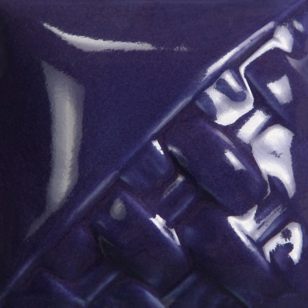 Glossy deep purple ceramic glaze sample with imprinted texture, showcasing firing technique and color depth for pottery projects.