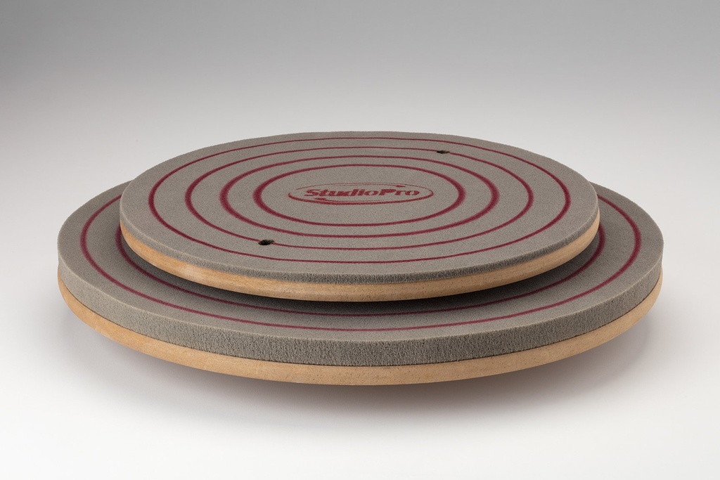 StudioPro banding wheels for pottery, featuring a smooth surface and spiral design, ideal for decorating and glazing ceramics.