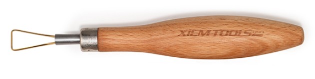 Ceramic ribbon tool with a wooden handle, ideal for sculpting and trimming clay in pottery and ceramics.