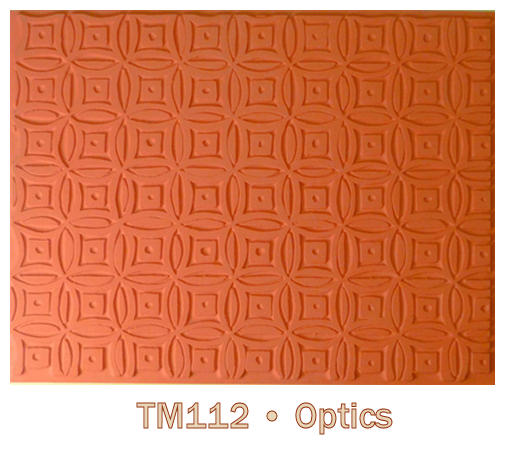 Textured orange clay slab featuring a geometric pattern, ideal for ceramic decoration and mold making at Georgies Ceramic & Clay Company.