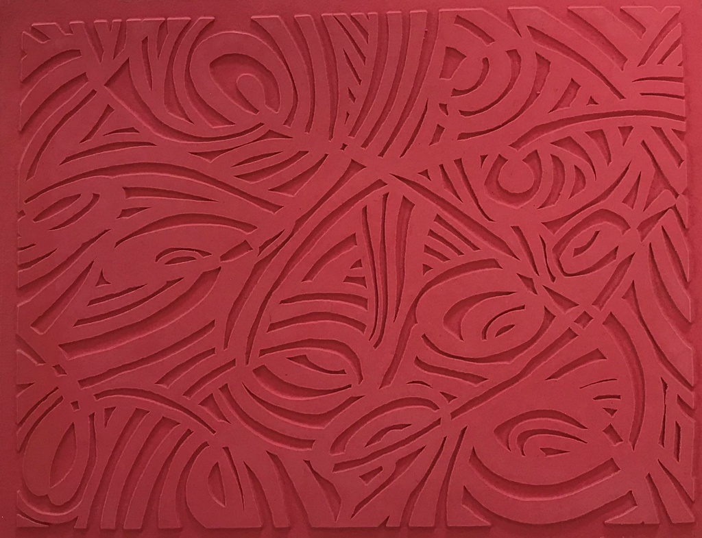 Red clay texture mat featuring intricate cut-out patterns, ideal for adding decorative elements to pottery and ceramic projects.