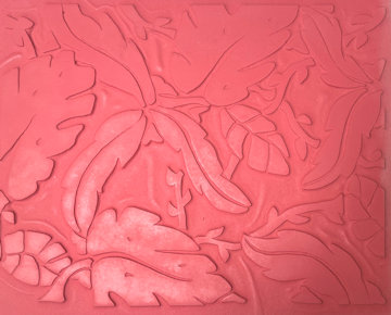 Textured red clay slab featuring intricate leaf and vine designs, ideal for ceramic decorating or sculptural applications.