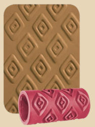 Textured clay roller in red next to impression on tan clay, showcasing decorative pattern for pottery and ceramics.