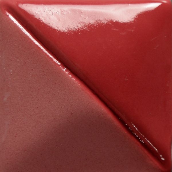 A glossy red ceramic glaze split into two tones, showcasing a shiny and a matte finish, ideal for pottery decoration.
