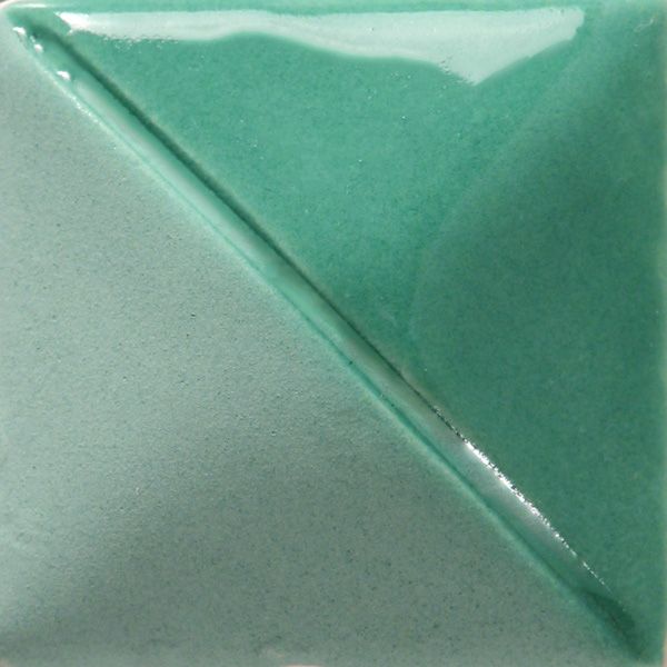 Green and teal glazed ceramic tile showing a diagonal split, highlighting texture and color variation for pottery decoration.
