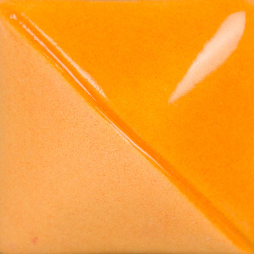 Close-up of a ceramic glaze sample showing a vibrant orange hue with a glossy finish and a smooth, textured transition.