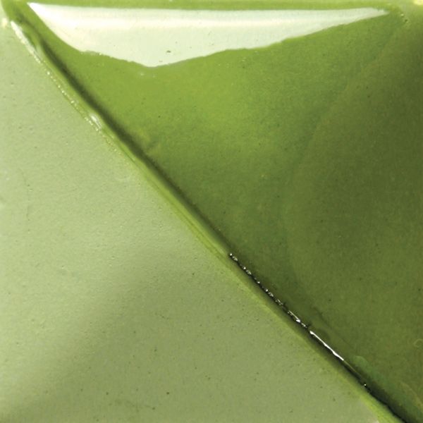 Glossy green ceramic glaze sample showcasing variations in hue and texture, ideal for decorating pottery and stoneware.