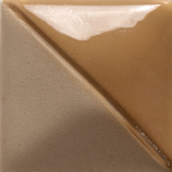 A bisque-fired tile featuring a glossy ochre glaze on one half and a matte beige finish on the other.
