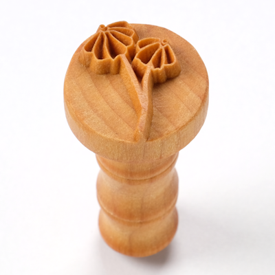 Wooden flower carving tool with floral design, ideal for decorating ceramics and pottery at Georgies Ceramic & Clay Company.