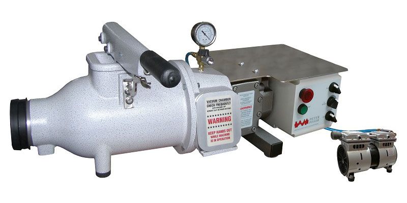 Vacuum de-airing pugmill for ceramics, featuring pressure gauges and controls for clay preparation and sculpture creation.