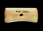 Wooden hand tool with MAN TOOLS engraved, designed for shaping and finishing ceramics in pottery and sculpting.