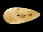 Wooden clay tool with a smooth, teardrop shape and a hole, labeled MKM Tools, used for sculpting and detailing pottery.