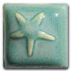 A square ceramic tile glazed in a soft turquoise color, featuring a lightly impressed starfish design.