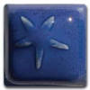 Blue ceramic tile with a starflower design, showcasing a glossy glaze and intricate texture, ideal for pottery projects.