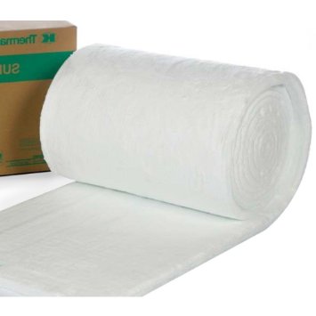Roll of white ceramic kiln insulation blanket next to its cardboard box, used for temperature control during firing.