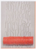 Textured clay surface with a pink ceramic texture roller, creating a bark-like pattern for pottery decoration.