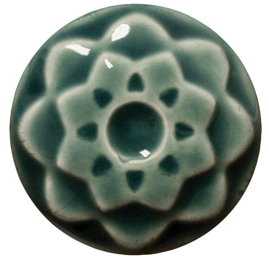 Teal glazed ceramic flower form with intricate petal details, showcasing a glossy finish ideal for decorative pottery.