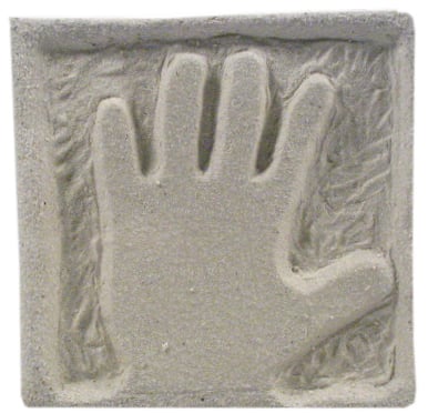 Hand-shaped imprint in light clay with textured background, ideal for ceramic decoration or sculpture projects.